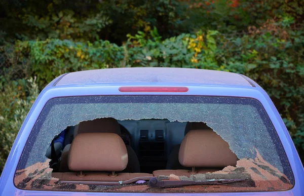 Broken car rear window. Busted back window of car. Rear windscreen of car smashed up, car back window broken and crashed