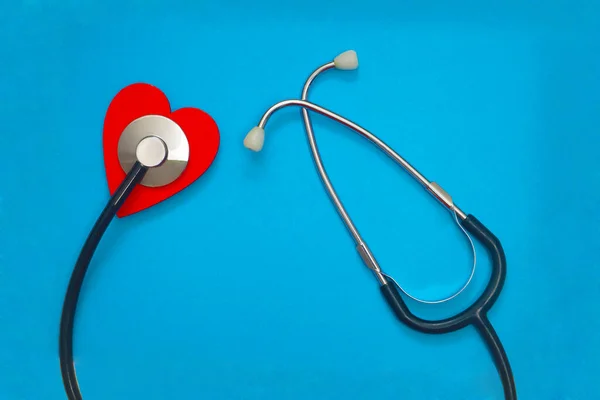 Red Heart Stethoscope Blue Paper Background Health Care Concept — Stock Photo, Image