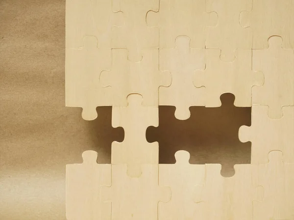 Placing missing a piece of wooden puzzle. business concept. .