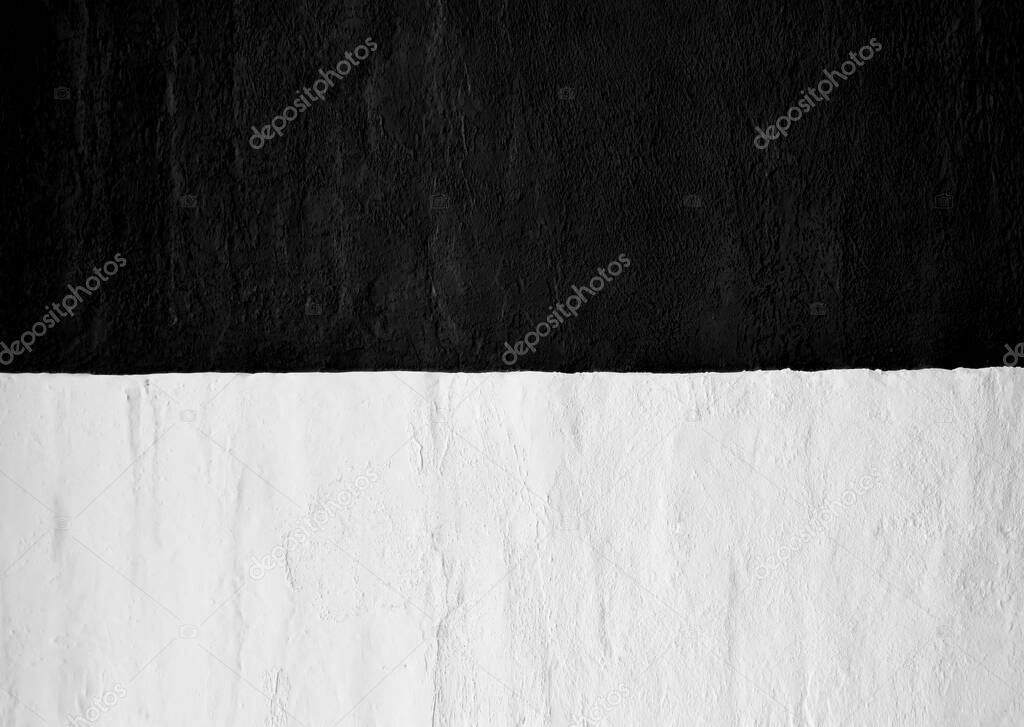 East Prussia flag on concrete wall. Patriotic  background. National flag of East Prussia. black and white flag depicted in bright paint colors on old relief plastering wall. Textured banner on rough background