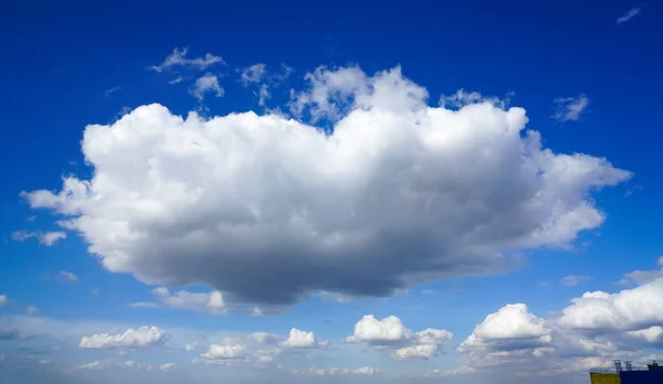 blue sky with big clouds. beautiful sky as a postcard. large fluffy white clouds in blue sky