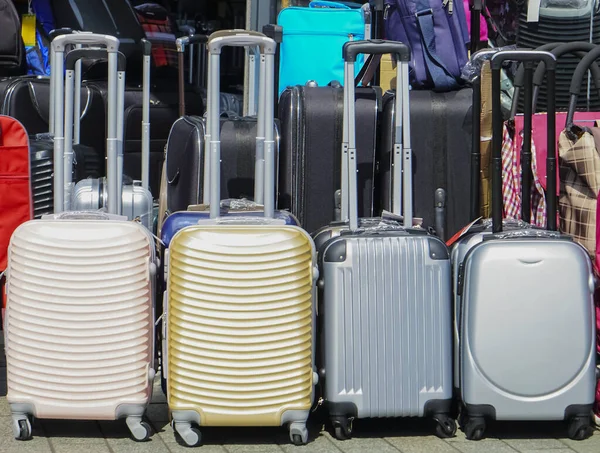 Suitcases in the shop window. Luggage bags in the store. Sale of suitcases for trips. Suitcases. Holiday and travel concept