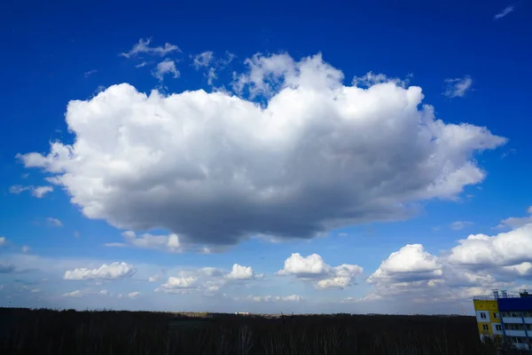 blue sky with big clouds. beautiful sky as a postcard. large fluffy white clouds in blue sky