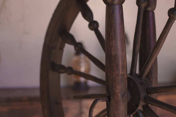 Old brown wooden spinning wheel background