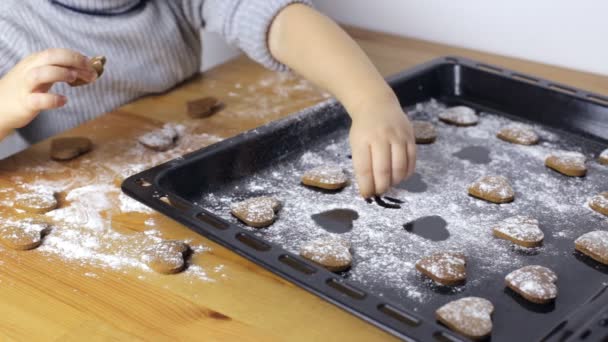 Young girl makes heart shaped cookies — Stock Video