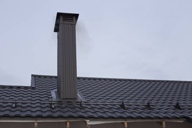 Modern materials for building a house. Black roof