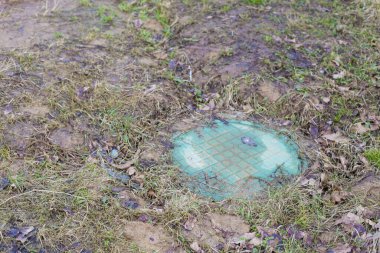 Private sewer hatch. Concept of suburban infrastructure