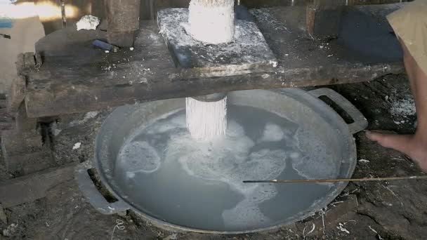 Man pressing rice dough; Rice noodles are cooked in boiling water straightaway — Stock Video