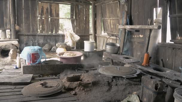 Inside a rice noodles workshop with boiling water over in-ground fire pit — Stock Video