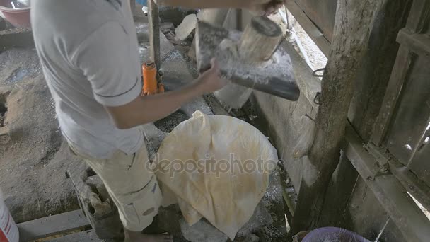 Man filling noodle pressing machine with rice dough ( close up) — Stock Video