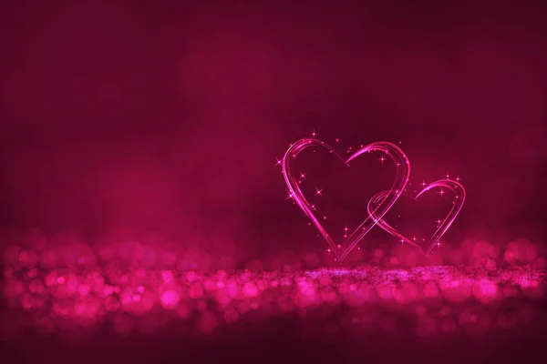 Two heart lighting on pink color bokeh background. — Stock Photo, Image