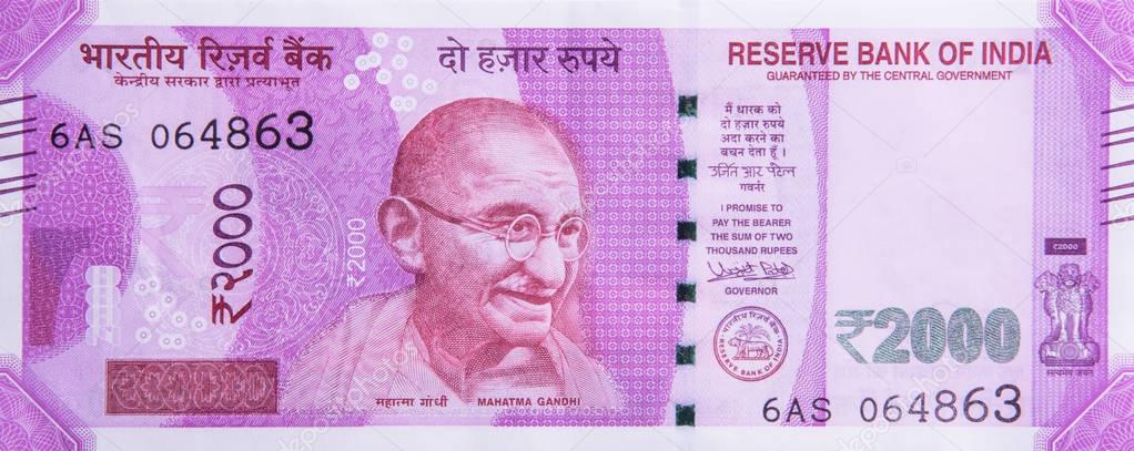 Indian new currency note of rupees 2000 with photo of gandhiji, isolated on white background, closeup, indian currency note, indian paper currency, back side