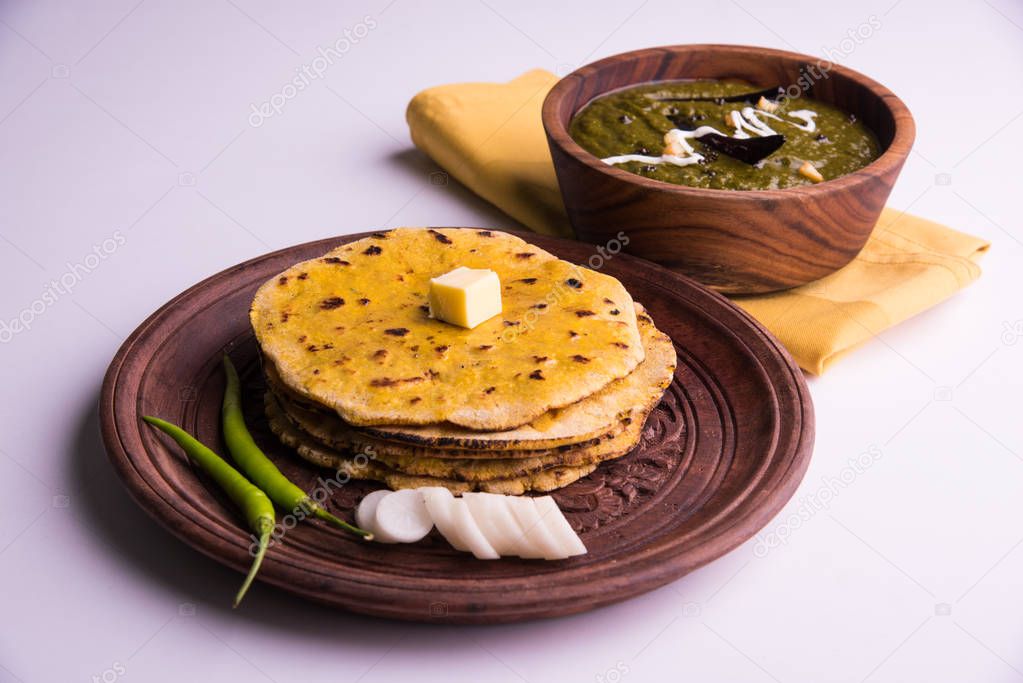 corn flour flat bread or roti or Makki Ki Roti with sarso da Saag or mustard leaves curry, Indian Food popular in winter season in north india