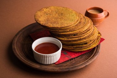 Indian famous delicious Fenugreek khakra or kasuri methi, gujarathi or gujrati snacks clipart