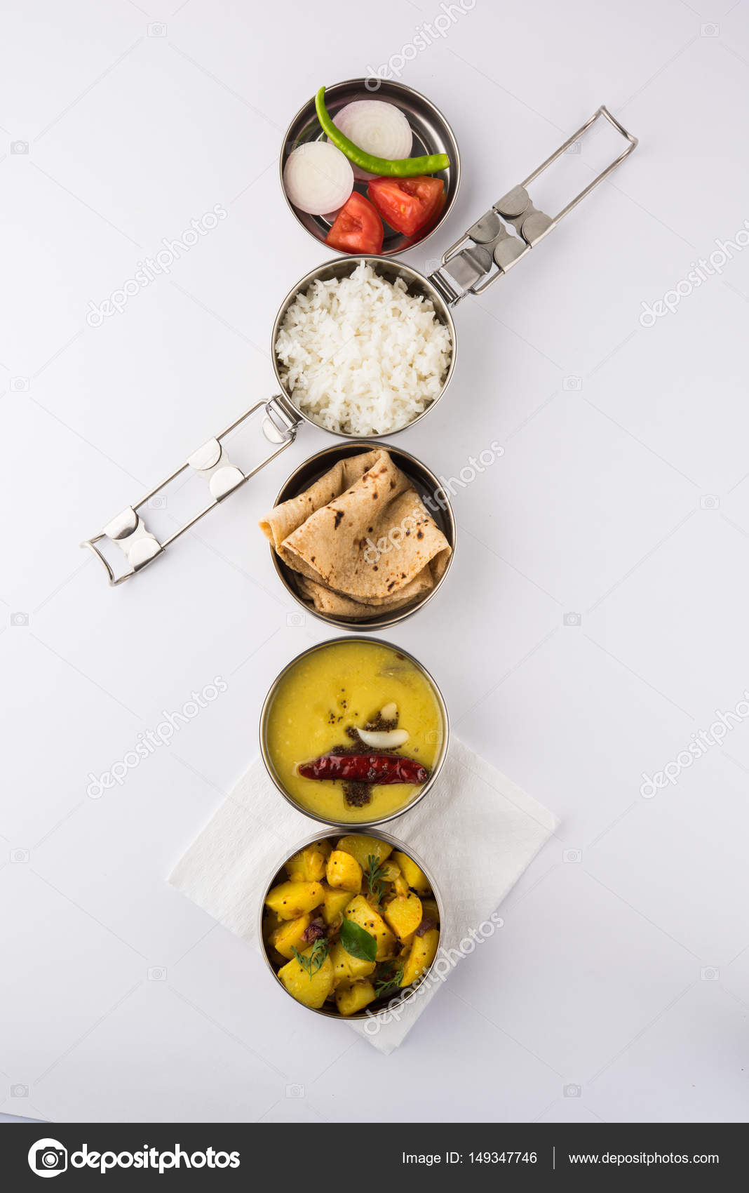 https://st3.depositphotos.com/5653638/14934/i/1600/depositphotos_149347746-stock-photo-indian-typical-stainless-steel-lunch.jpg