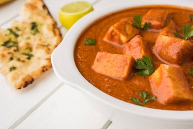 paneer butter masala or cheese cottage curry, popular indian lunch/dinner menu in weddings or parties, selective focus clipart