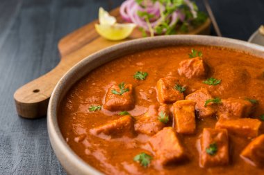 paneer butter masala or cheese cottage curry, popular indian lunch/dinner menu in weddings or parties, selective focus clipart