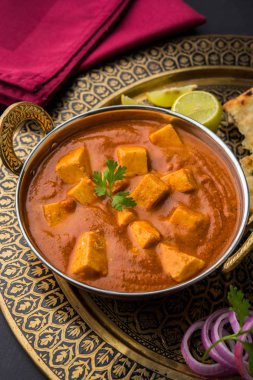 paneer butter masala or cheese cottage curry, popular indian lunch/dinner menu in weddings or parties, selective focus clipart