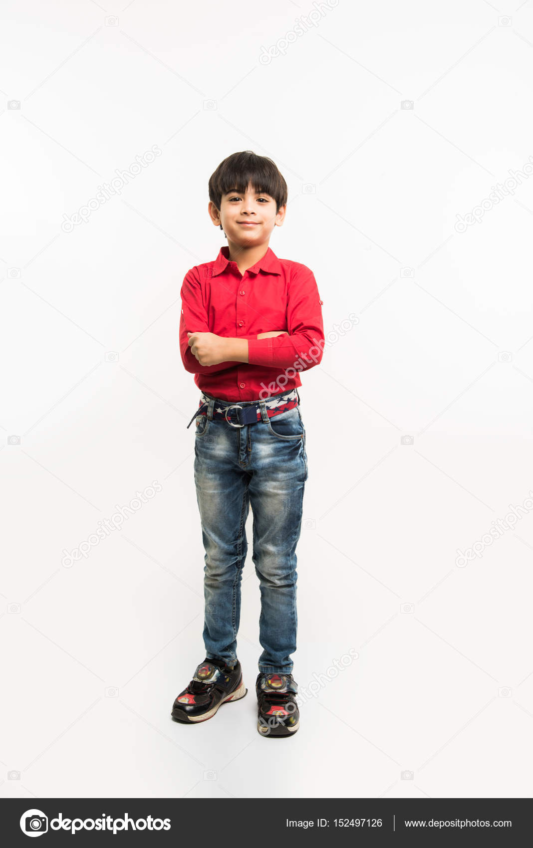 Indian smart kid or boy standing over white background and with hands  folded Stock Photo by ©stockimagefactory.com 152497126