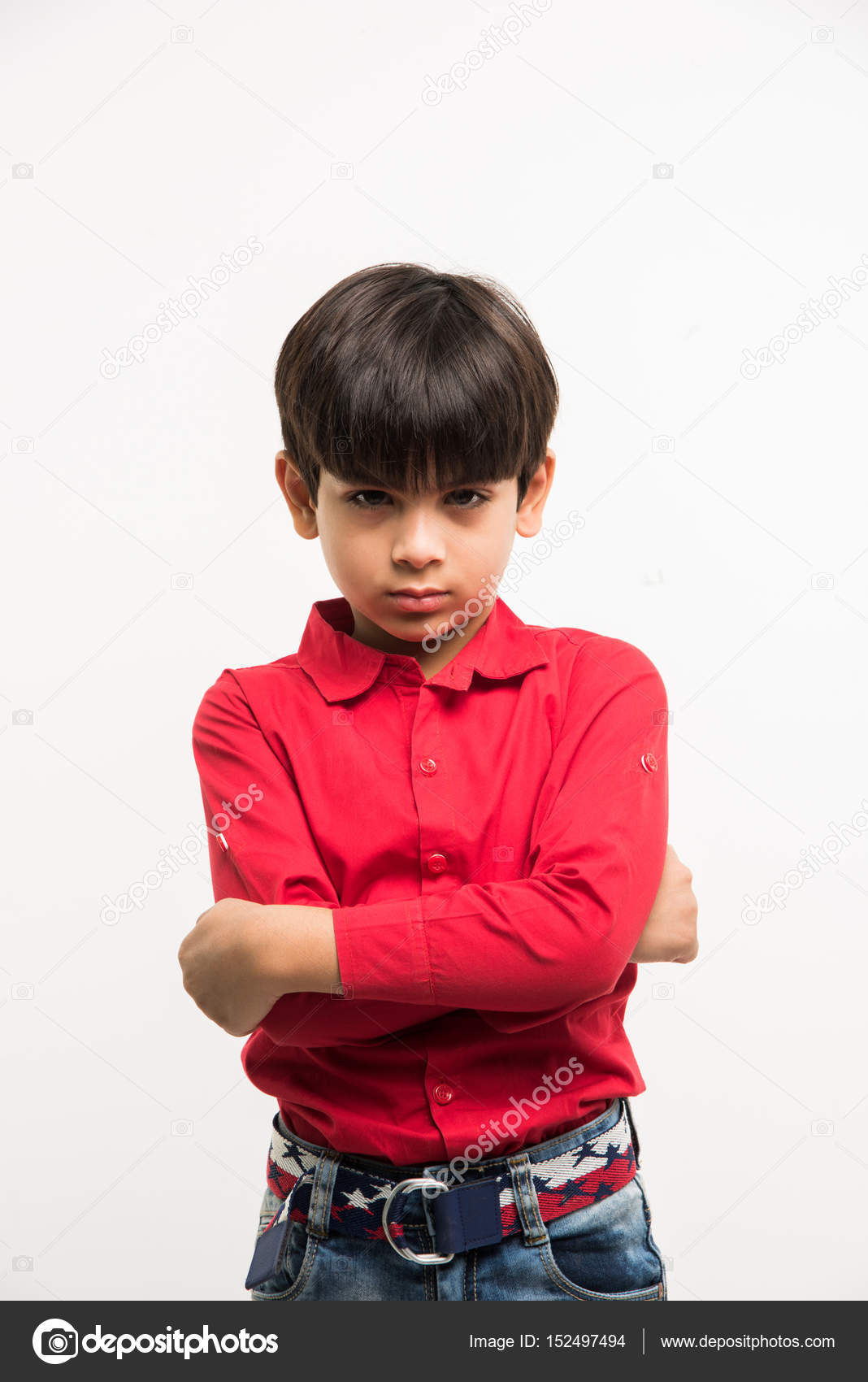 Indian smart kid or boy with sad facial expressions or crying while  standing over white background and with hands folded Stock Photo by  © 152497494