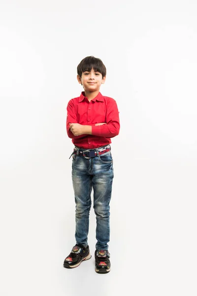 Indian smart kid or boy standing over white background and with hands folded — Stock Photo, Image