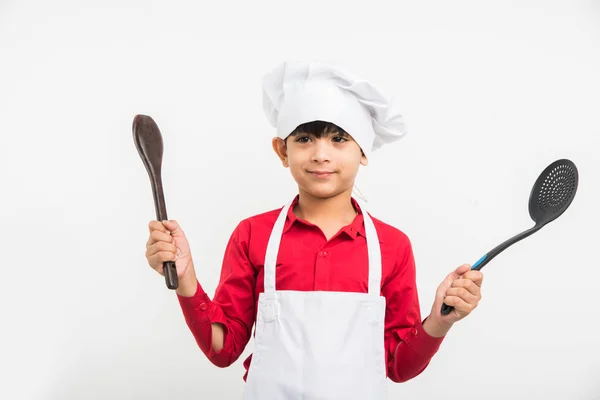 Indian kid chef career, indian cute boy in chef or cook uniform over white background — Stock Photo, Image