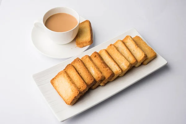 indian punjabi or Delhi bread toast with tutti frutti flavour, served with indian hot tea, selective focus texture