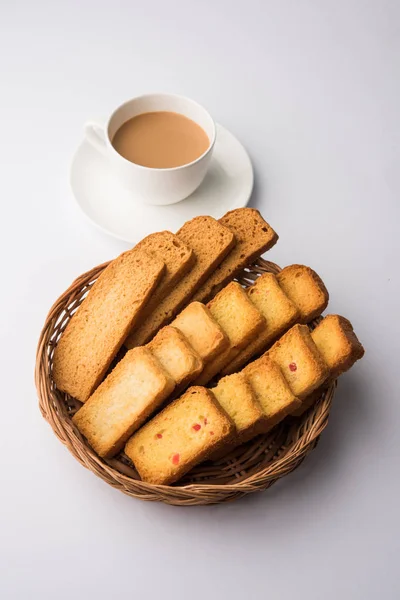 indian punjabi or Delhi bread toast with tutti frutti flavour, served with indian hot tea, selective focus texture