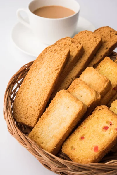 indian punjabi or Delhi bread toast with tutti frutti flavour, served with indian hot tea, selective focus texture