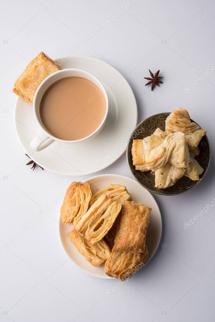 indian khari or kharee or salty Puff Pastry Snacks, served with indian hot tea, selective focus texture