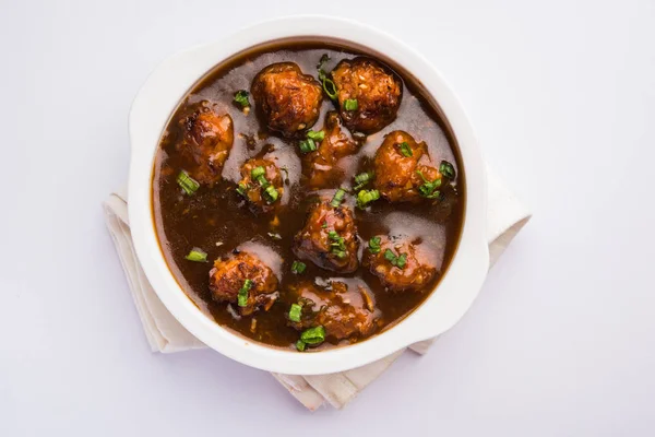 Gobi or veg Manchurian dry or with gravy - Popular street food of India made of cauliflower florets, selective focus — Stock Image Gobi or veg Manchurian dry or with gravy - Popular street food of India made of cauliflower florets, selective focus Royalty Free Stock Photos