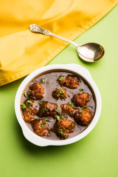 Gobi or veg Manchurian dry or with gravy - Popular street food of India made of cauliflower florets, selective focus — Stock Image Gobi or veg Manchurian dry or with gravy - Popular street food of India made of cauliflower florets, selective focus Stock Image
