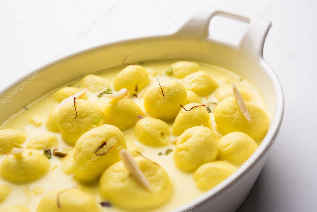   Save Download Preview Angoori rasmalai or anguri ras malai is an Indian dessert. Made from cottage cheese which is then soaked in chashni, a sugary syrup, and rolled in fine sugar to form grape-sized balls. selective focus
