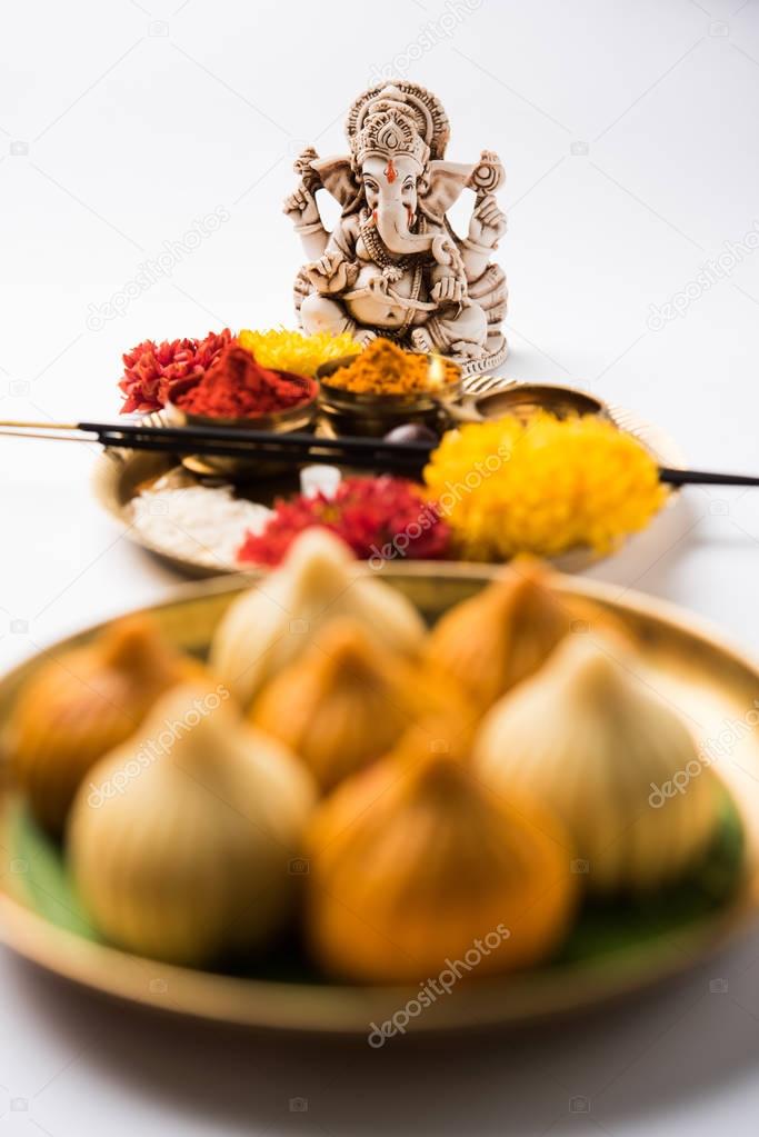 A modak is an Indian sweet dumpling popular in many parts of India. It is called modak in Marathi and Konkani as well as Gujarati language, Kozhakkatta in Malayalam, modhaka or kadubu in Kannada