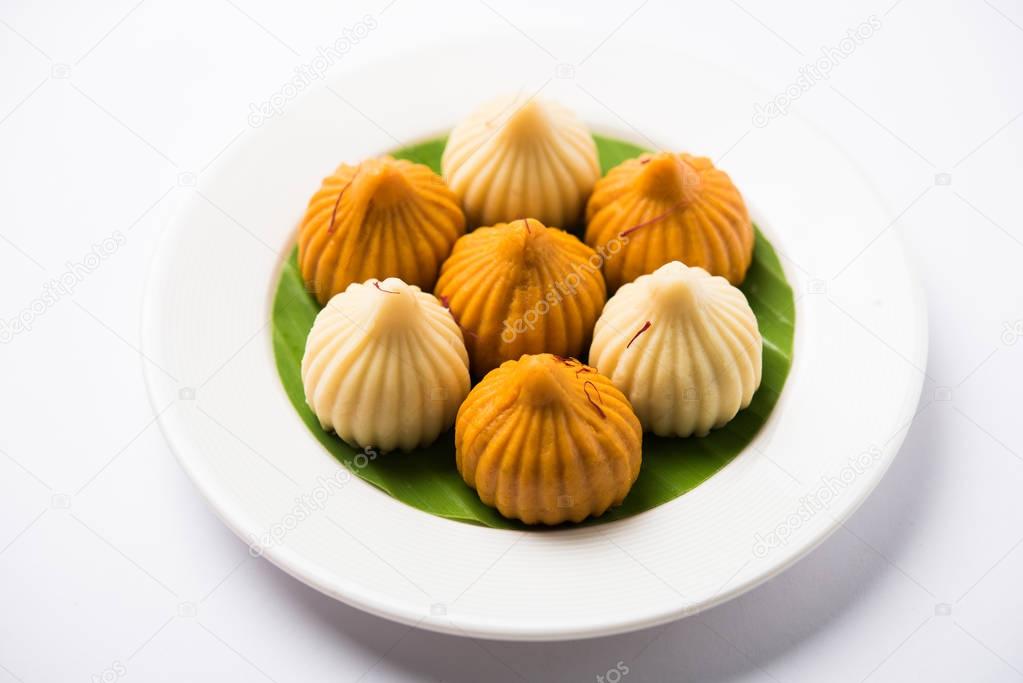 A modak is an Indian sweet dumpling popular in India. It is called modak, Kozhakkatta, modhaka, kadubu, modhakam, kozhakkattai, kudumu. made up of coconut and jaggery, rice flour, wheat with khova