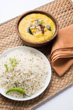 Indian popular food Dal fry or traditional Dal Tadka Curry served with jeera rice, selective focus clipart