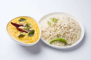 Indian popular food Dal fry or traditional Dal Tadka Curry served with jeera rice, selective focus clipart