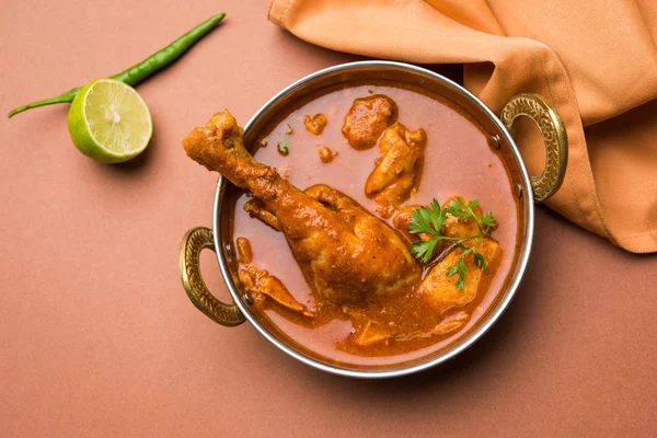 Indian spicy Chicken curry or masala chicken with prominent leg piece, popular recipe from India, selective focus — Stock Photo, Image