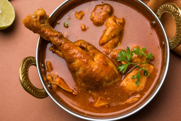 Indian spicy Chicken curry or masala chicken with prominent leg piece, popular recipe from India, selective focus — Stock Photo, Image