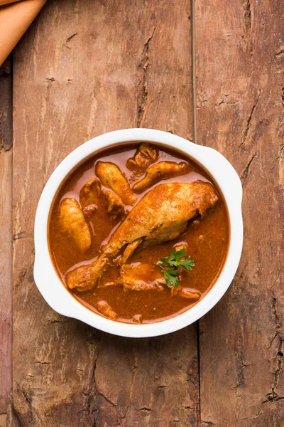 Indian spicy Chicken curry or masala chicken with prominent leg piece, popular recipe from India, selective focus — Stock Photo, Image