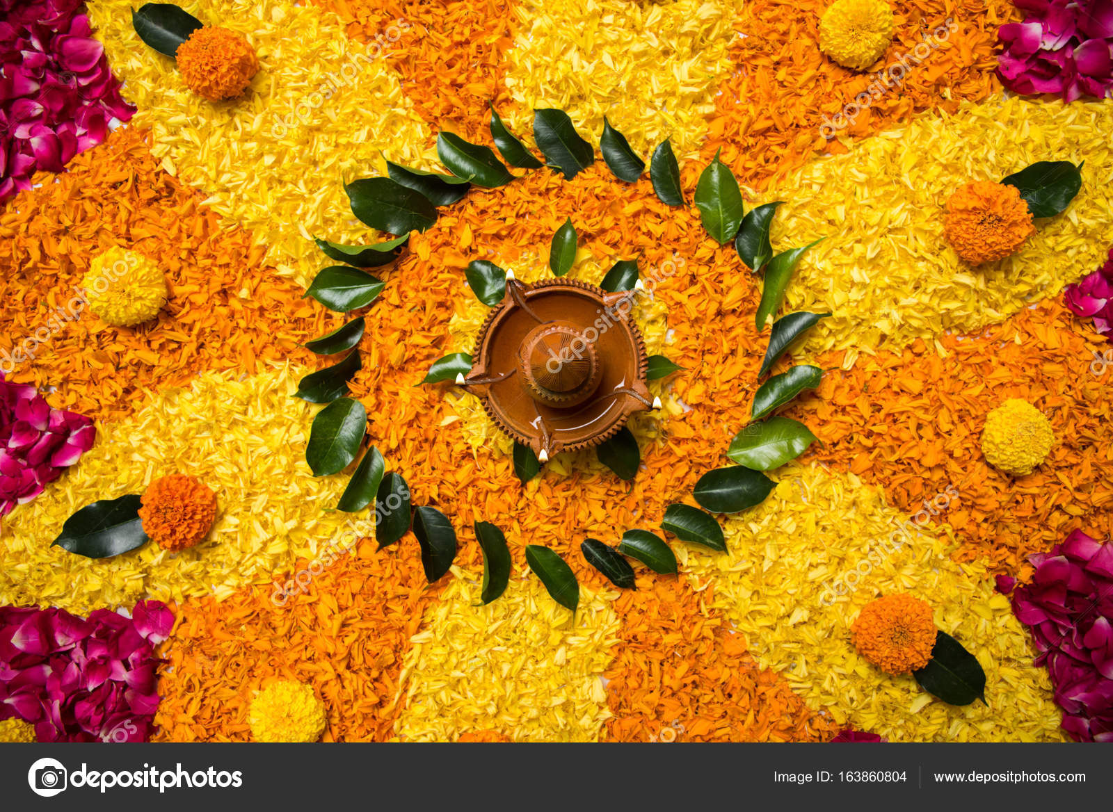 Flower rangoli for Diwali or pongal made using marigold or zendu ...