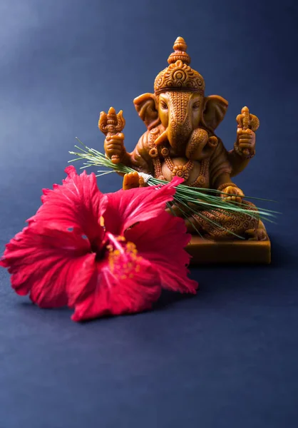 Happy Ganesh Chaturthi Greeting Card showing photograph of lord ganesha idol, pooja or puja thali, bundi laddu/modak, durva and hibiscus or jasvand flower — Stock Photo, Image