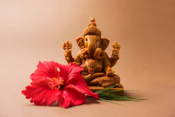 Happy Ganesh Chaturthi Greeting Card showing photograph of lord ganesha idol, pooja or puja thali, bundi laddu/modak, durva and hibiscus or jasvand flower — Stock Photo, Image