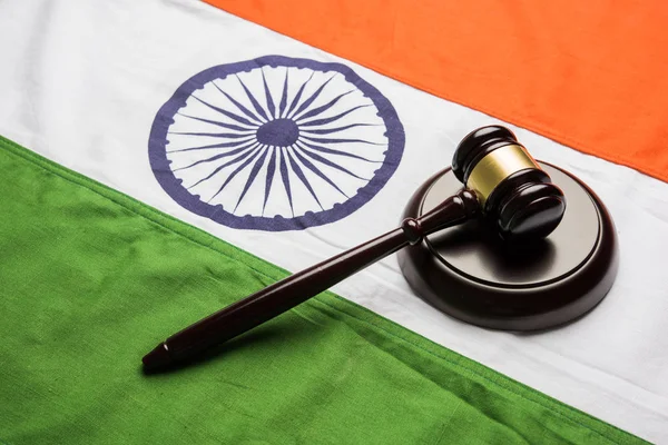 Stock photo showing Indian low and jurisdiction - Indian national flag or tricolour with wooden gavel showing concept of law in India — Stock Photo, Image