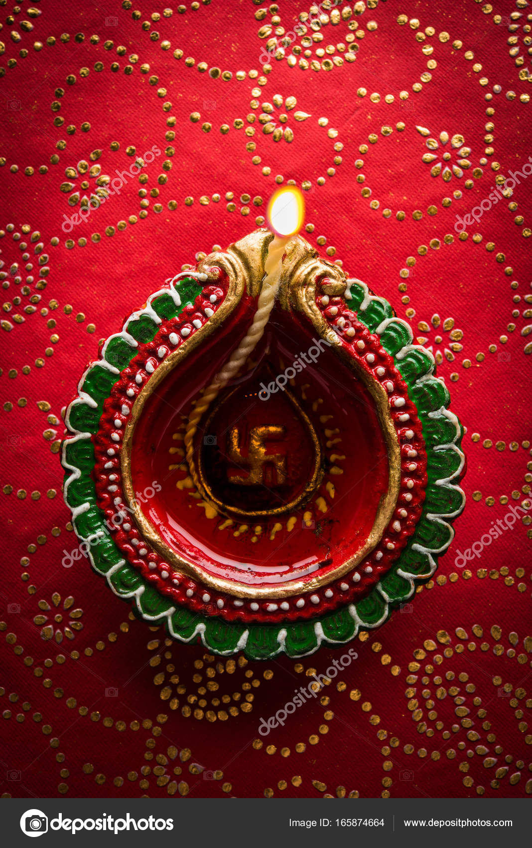 Stock Photo Of Beautiful Diwali Diya Isolated Over Decorative Background Moody Lighting And Selective Focus Stock Photo C Stockimagefactory Com 165874664