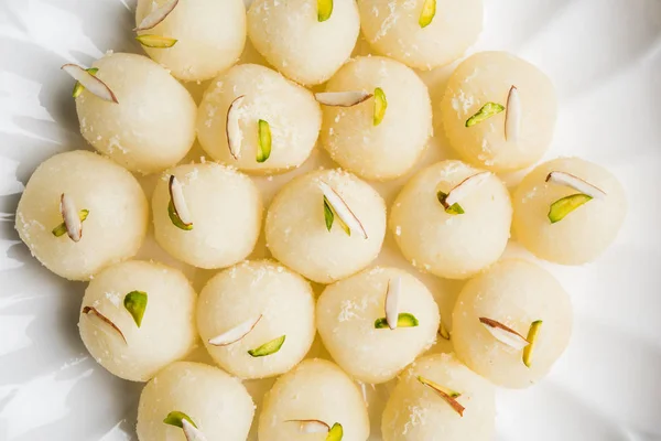 Stock Photo of Rasgulla or sponge Ras Gulla, It is made from ball shaped dumplings of chhena and semolina dough, cooked in light syrup made of sugar. — Stock Photo, Image