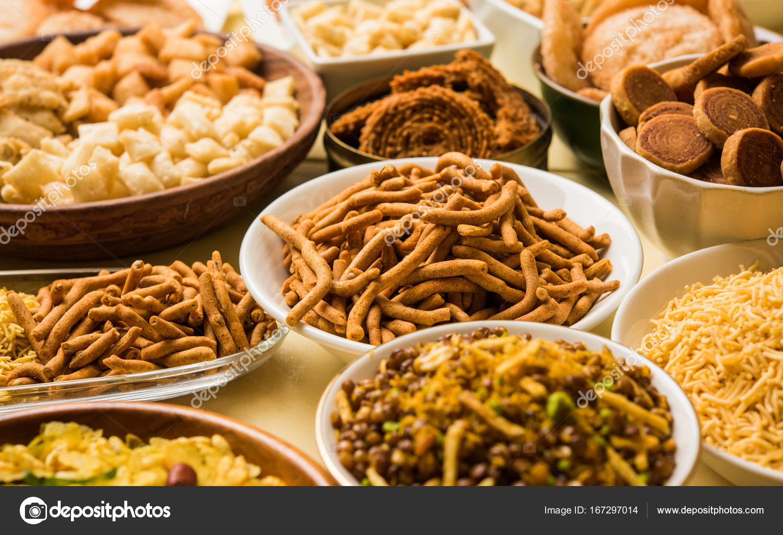 Stock photo of Diwali food or Diwali snacks or Diwali sweets like anarsa,  bakarvadi, chakli, sev, bhujiya, shankar pale and chivda or chiwada,  karanji, favourite indian diwali recipe, selective focus Stock Photo