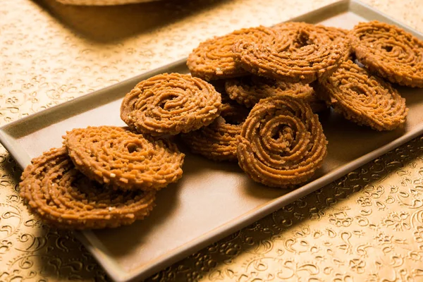 Stock Foto van Chakli of Chakali of Murukku, populaire zout voedsel gemaakt tijdens diwali festival — Stockfoto