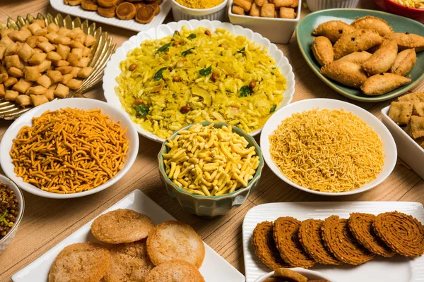 Stock photo of  Diwali food or Diwali snacks or Diwali sweets like anarsa, bakarvadi, chakli, sev, bhujiya, shankar pale and chivda or chiwada, karanji, favourite indian diwali recipe, selective focus — Stock Photo, Image