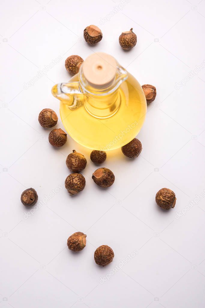 Aritha or Reetha and oil.  Soap-nuts is used as the main ingredient in soaps and shampoos also known as Sapindus emarginatus
